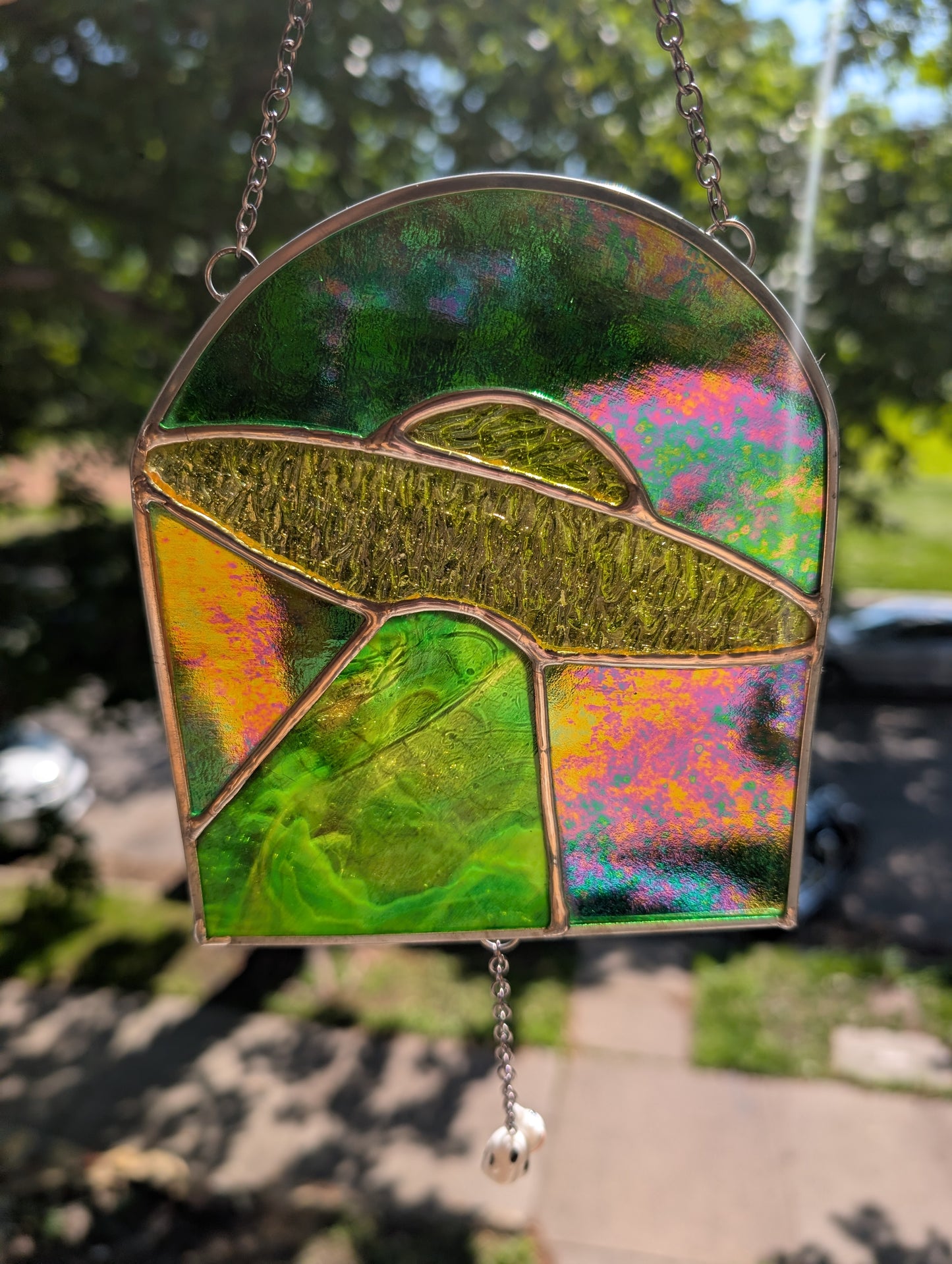 Handcrafted stained glass UFO beaming up a cow yellow and green