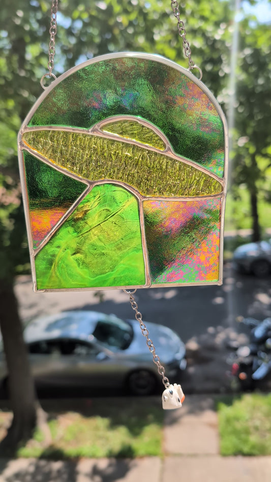 Handcrafted stained glass UFO beaming up a cow yellow and green