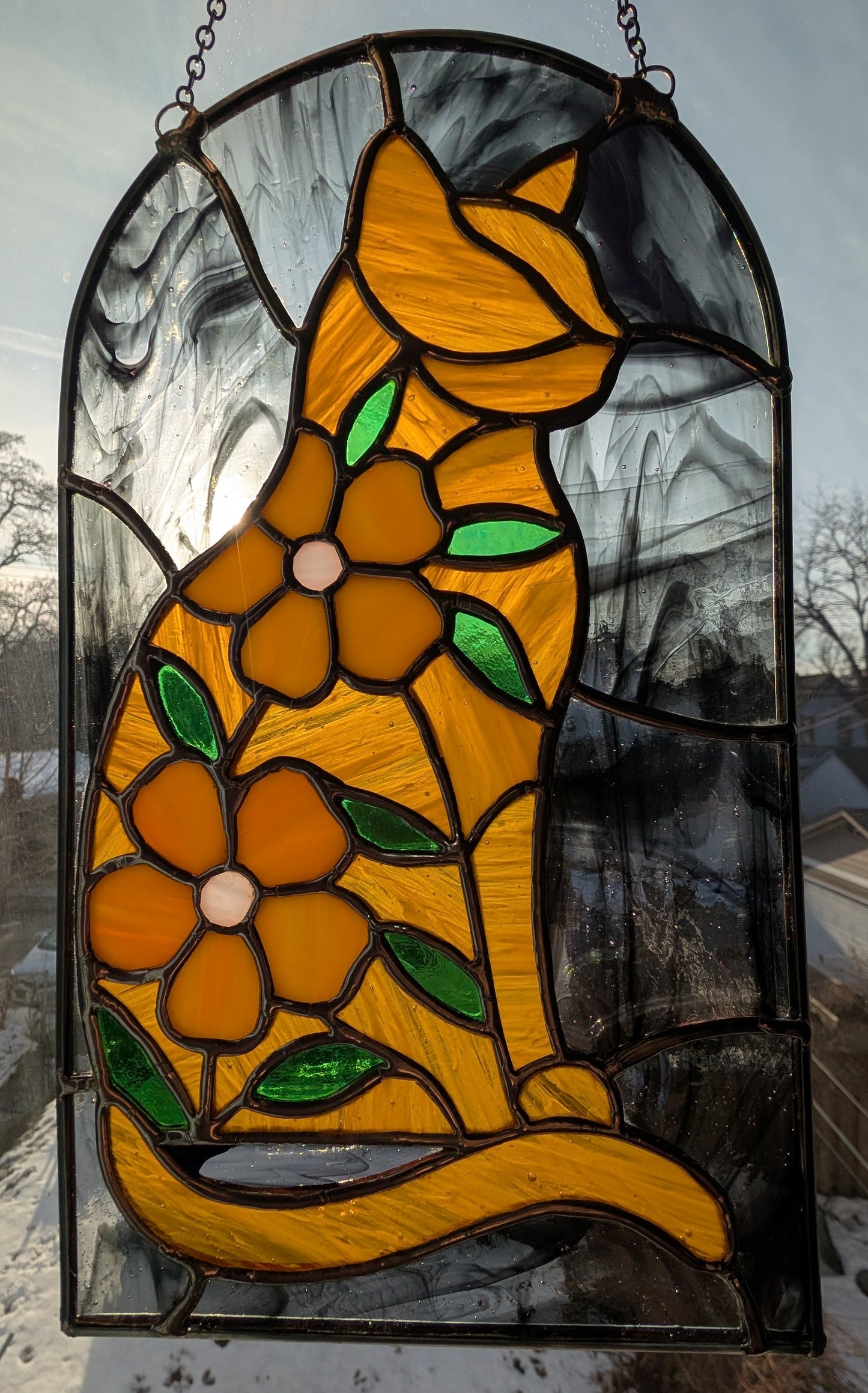 Handcrafted stained glass cat and flowers