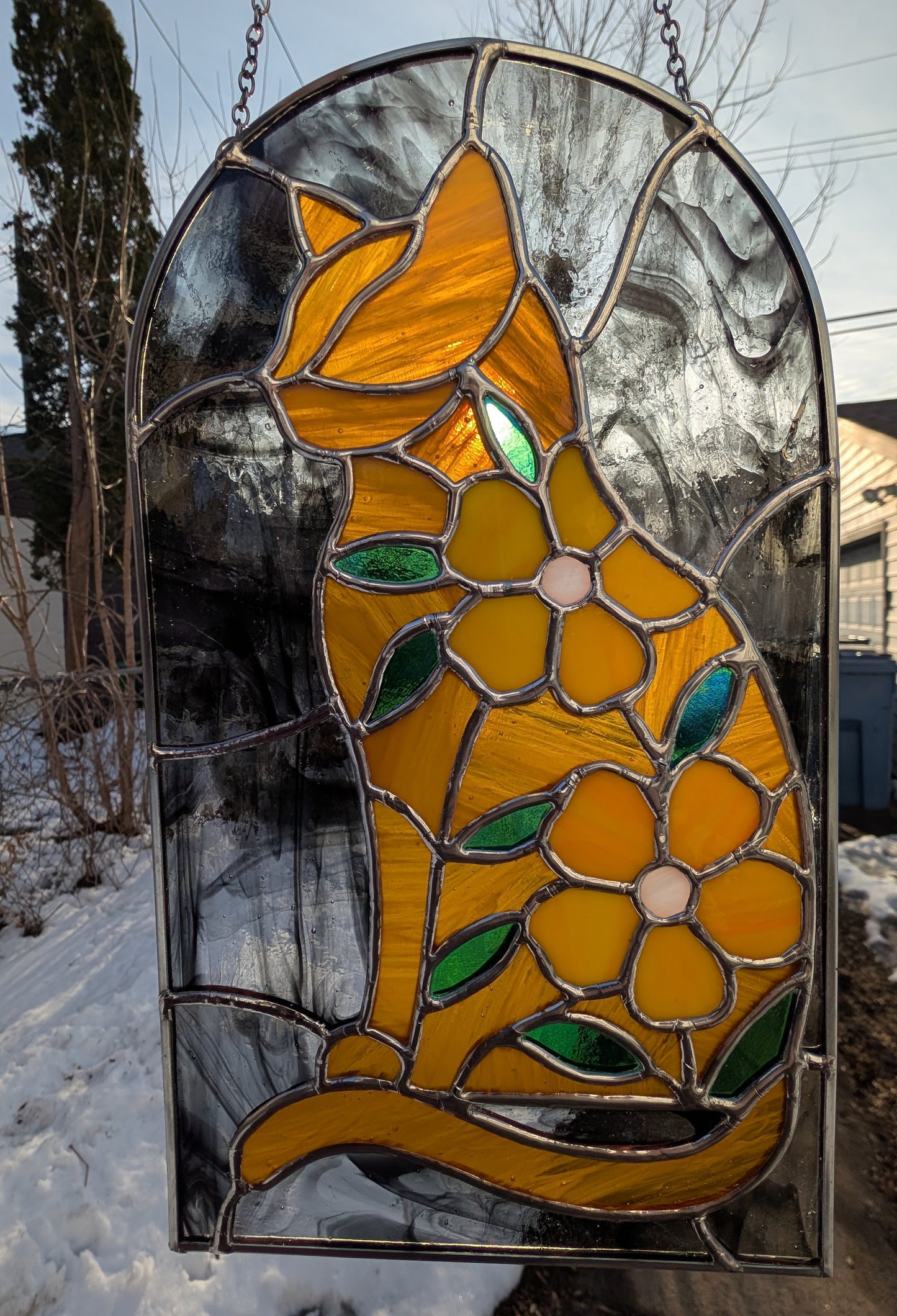 Handcrafted stained glass cat and flowers