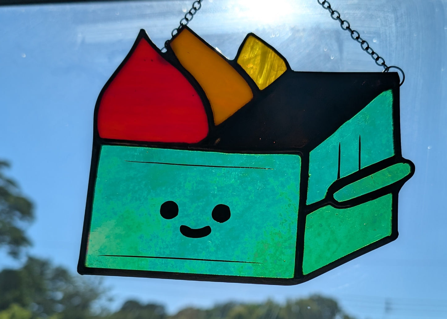 Stained glass sun catcher dumpster fire