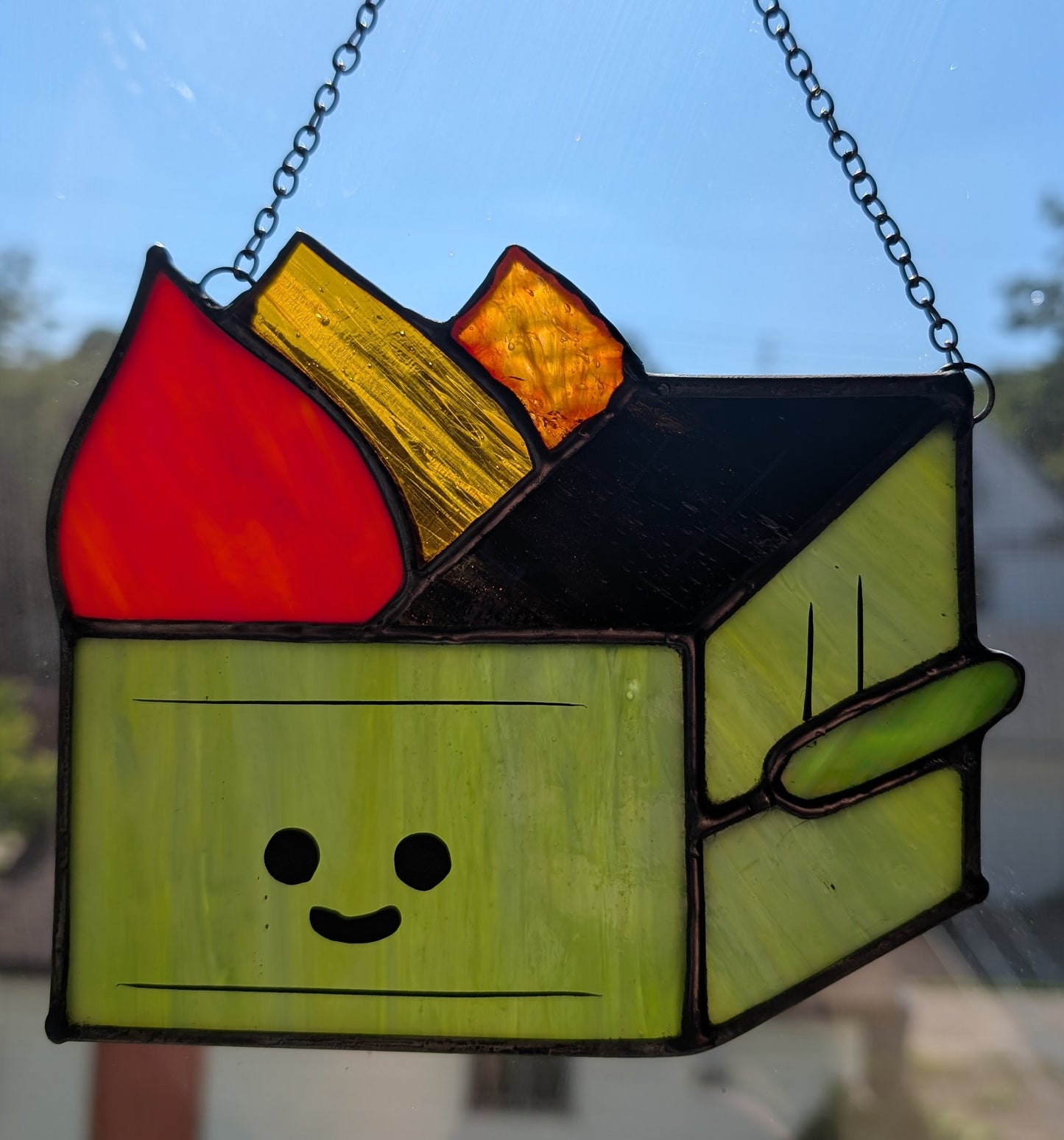 Stained glass sun catcher dumpster fire