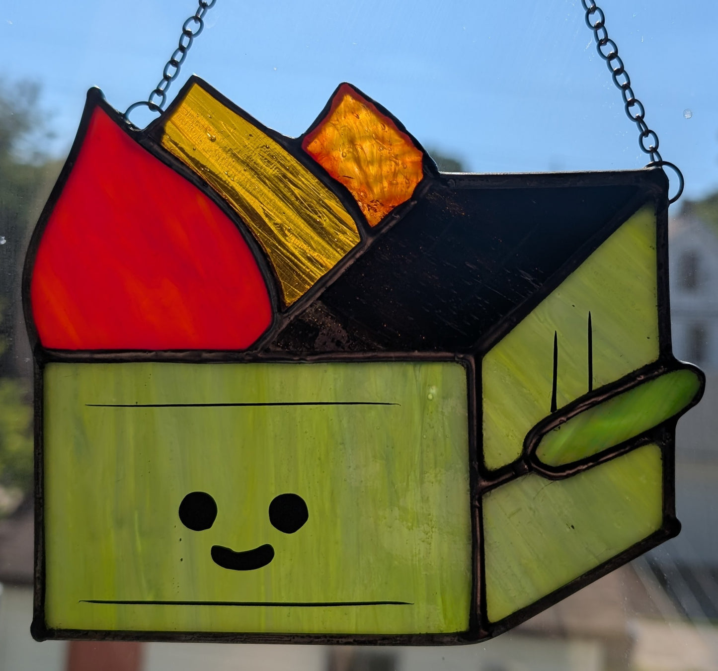 Stained glass sun catcher dumpster fire