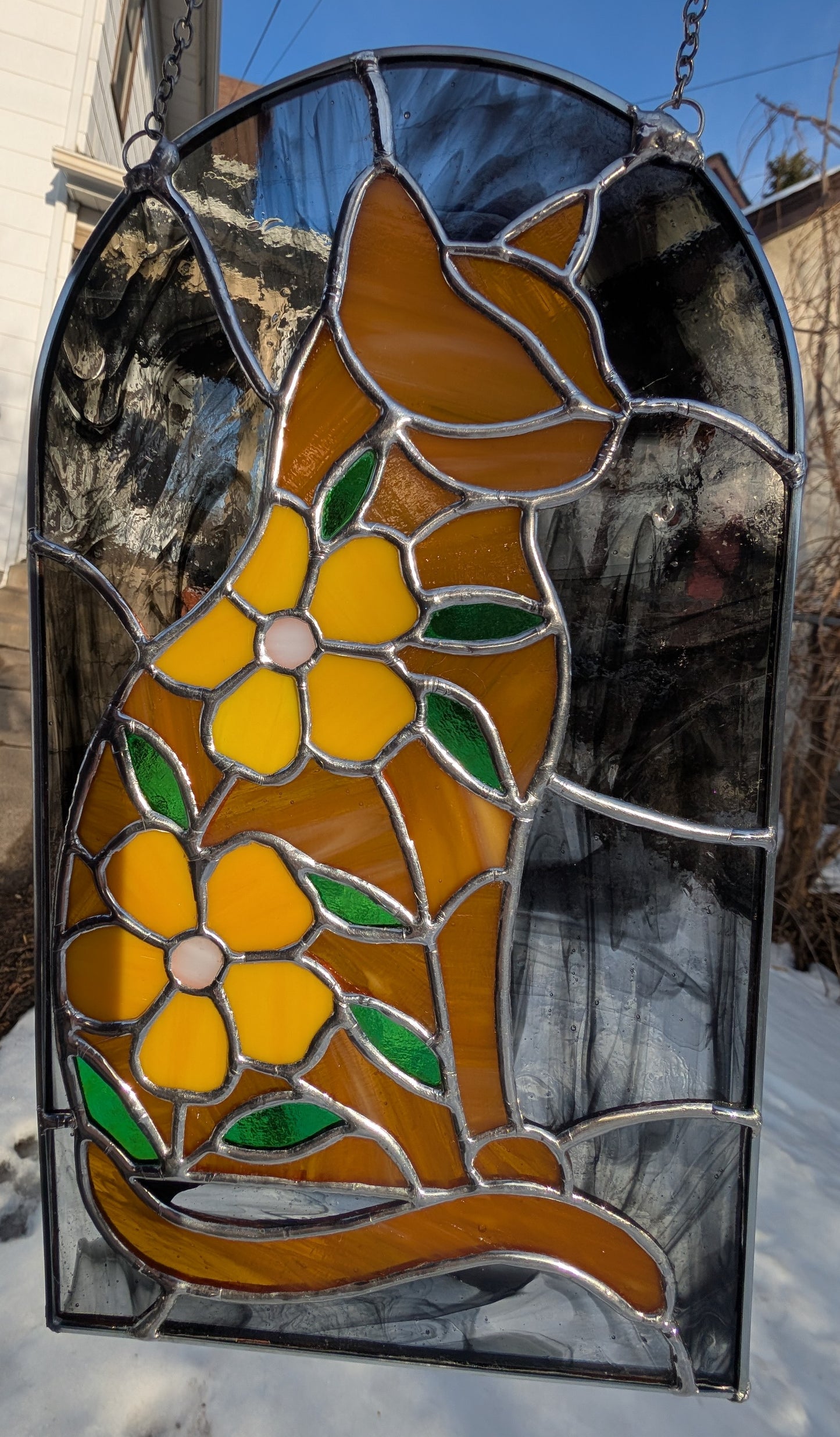 Handcrafted stained glass cat and flowers