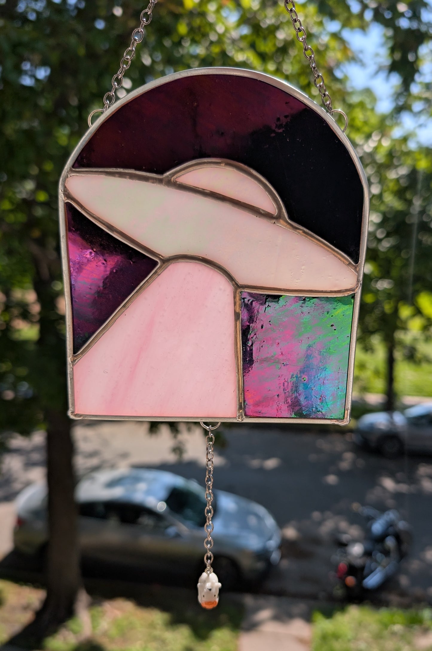 Handcrafted stained glass UFO beaming up a cow pink and black iridescent
