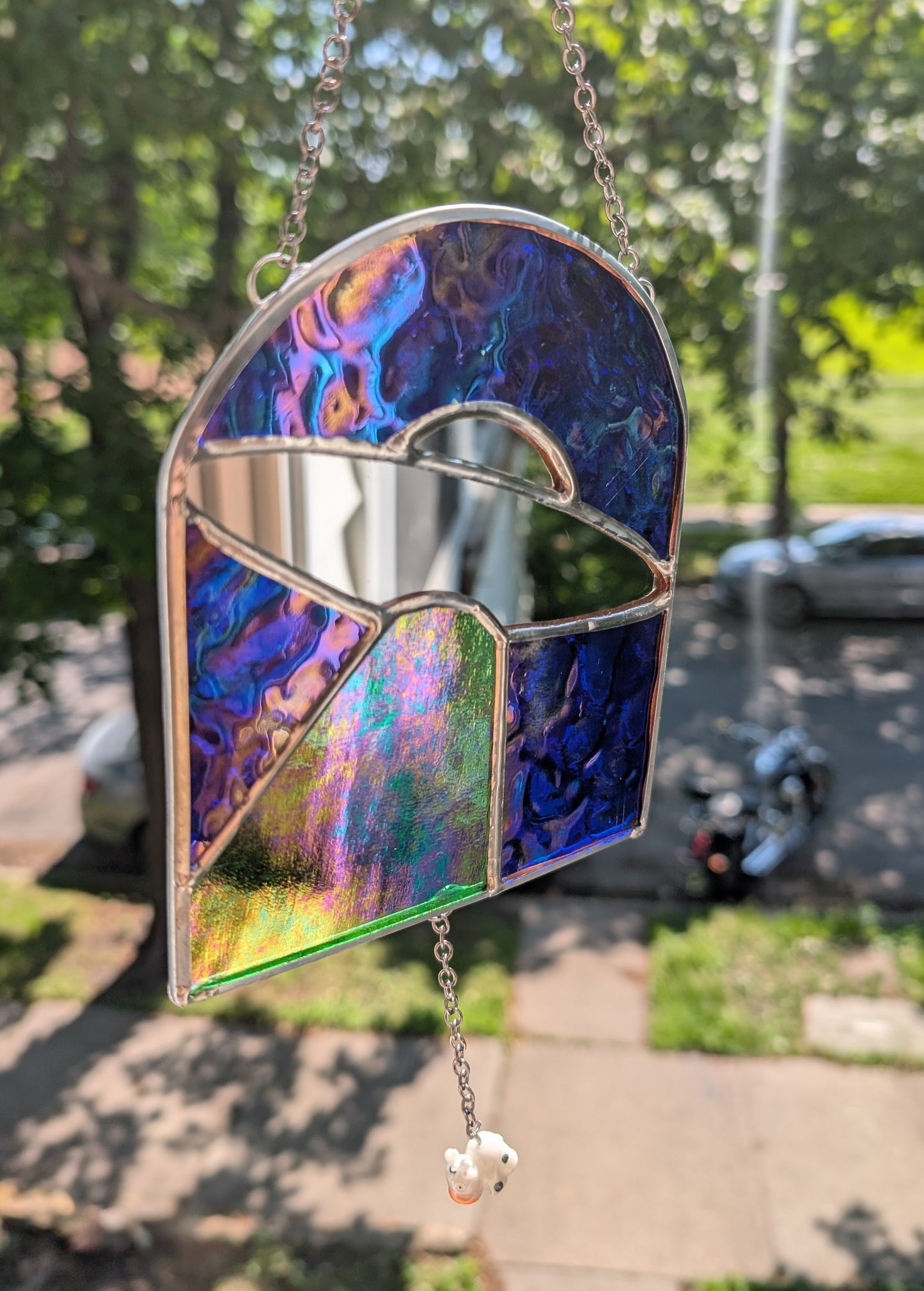 Handcrafted stained glass UFO beaming up a cow blue, green, and mirror