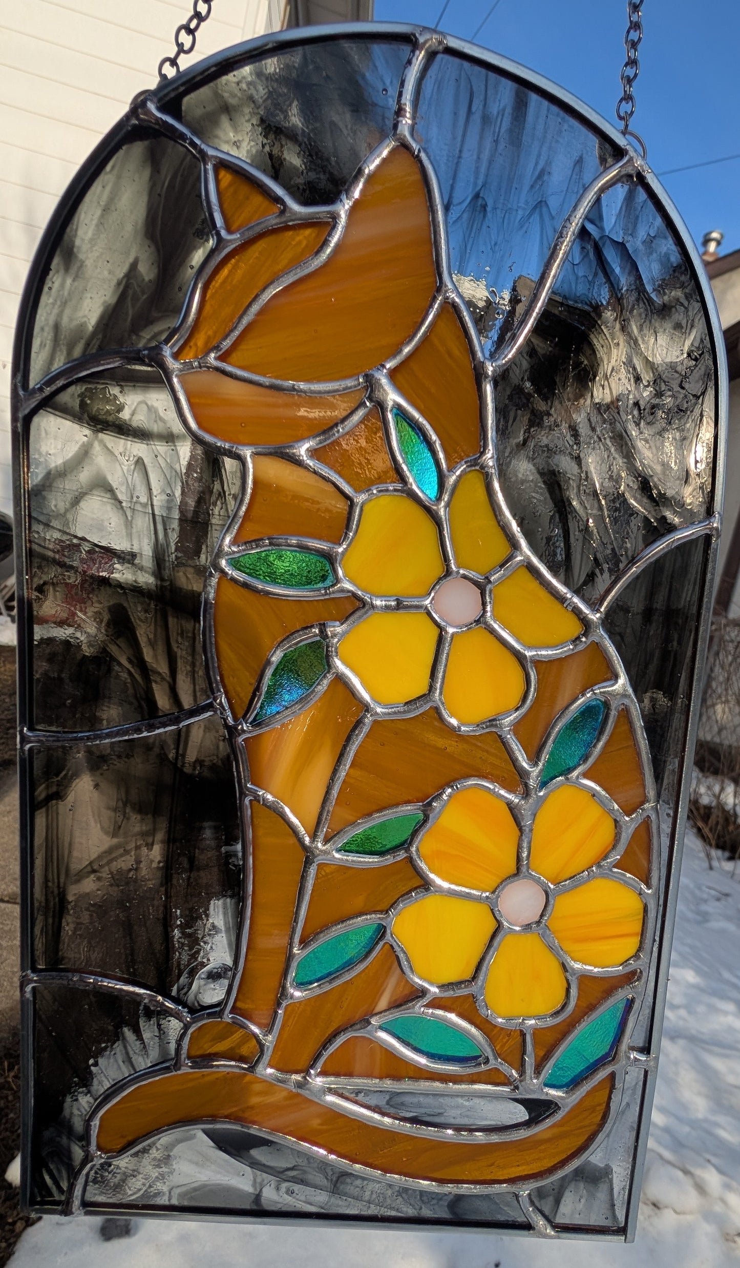 Handcrafted stained glass cat and flowers