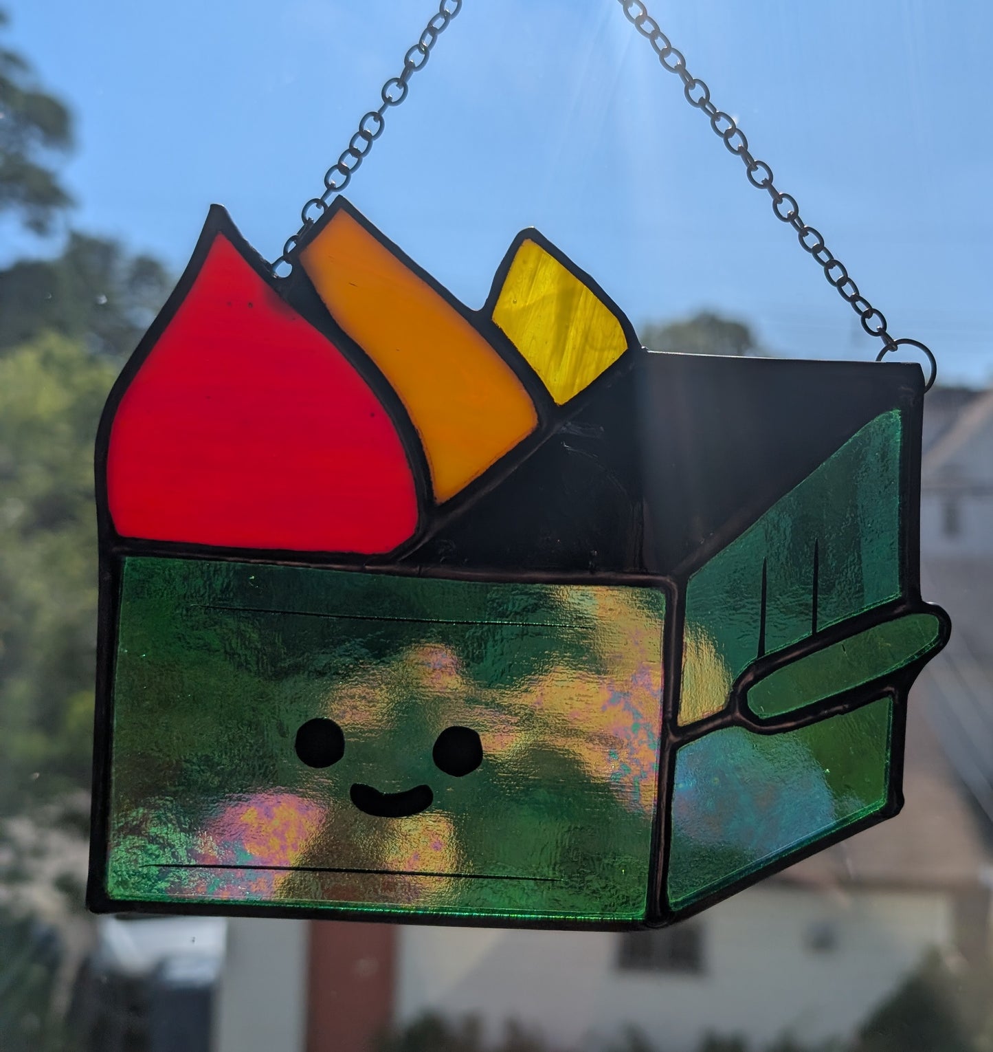 Stained glass sun catcher dumpster fire