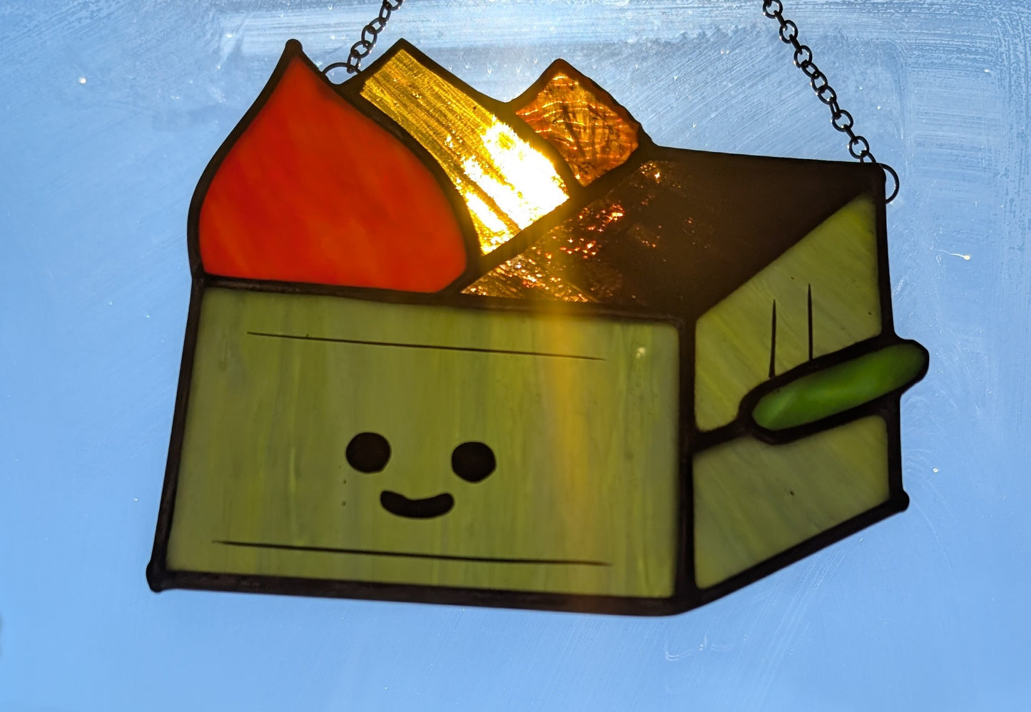 Stained glass sun catcher dumpster fire