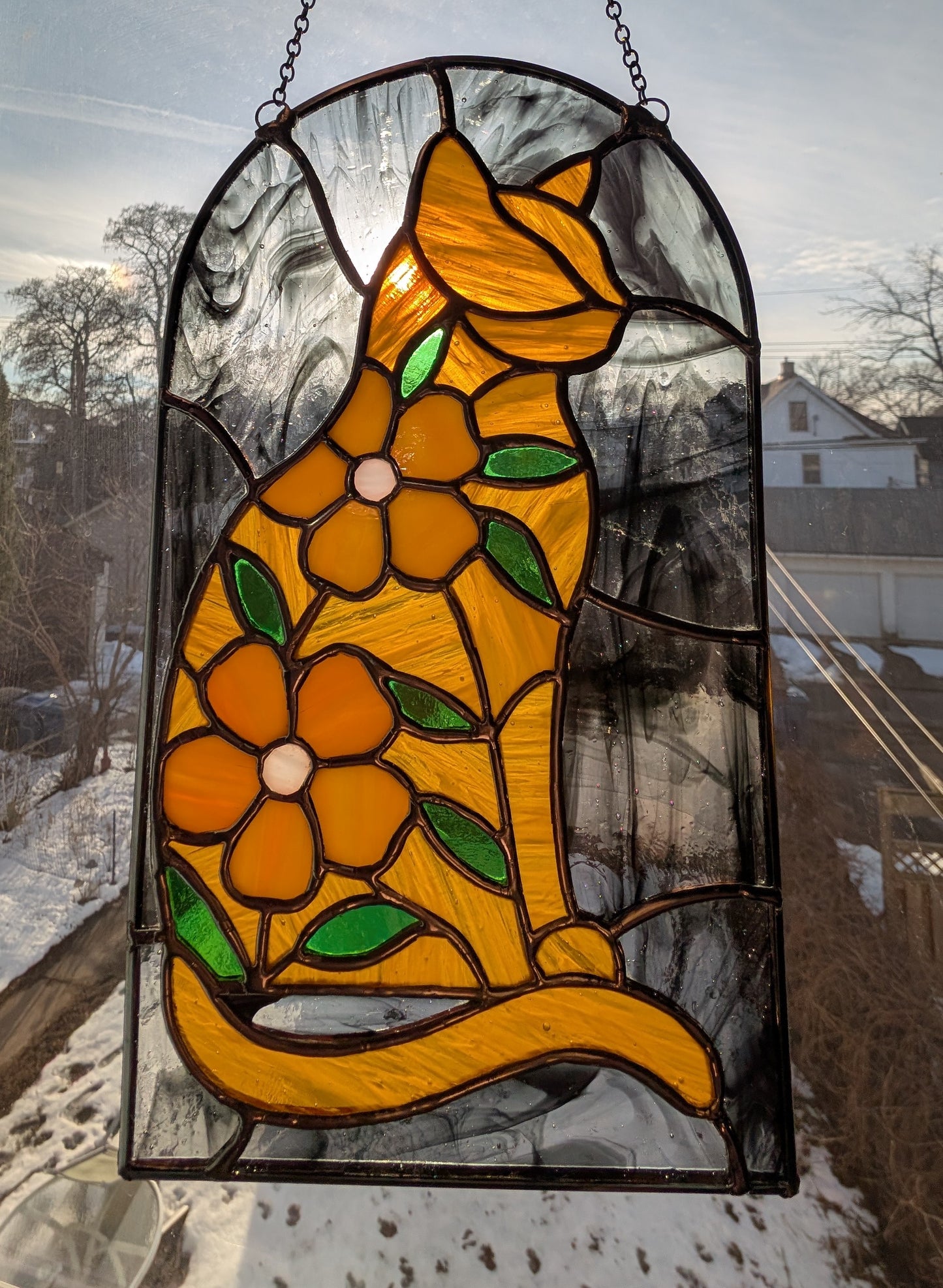 Handcrafted stained glass cat and flowers