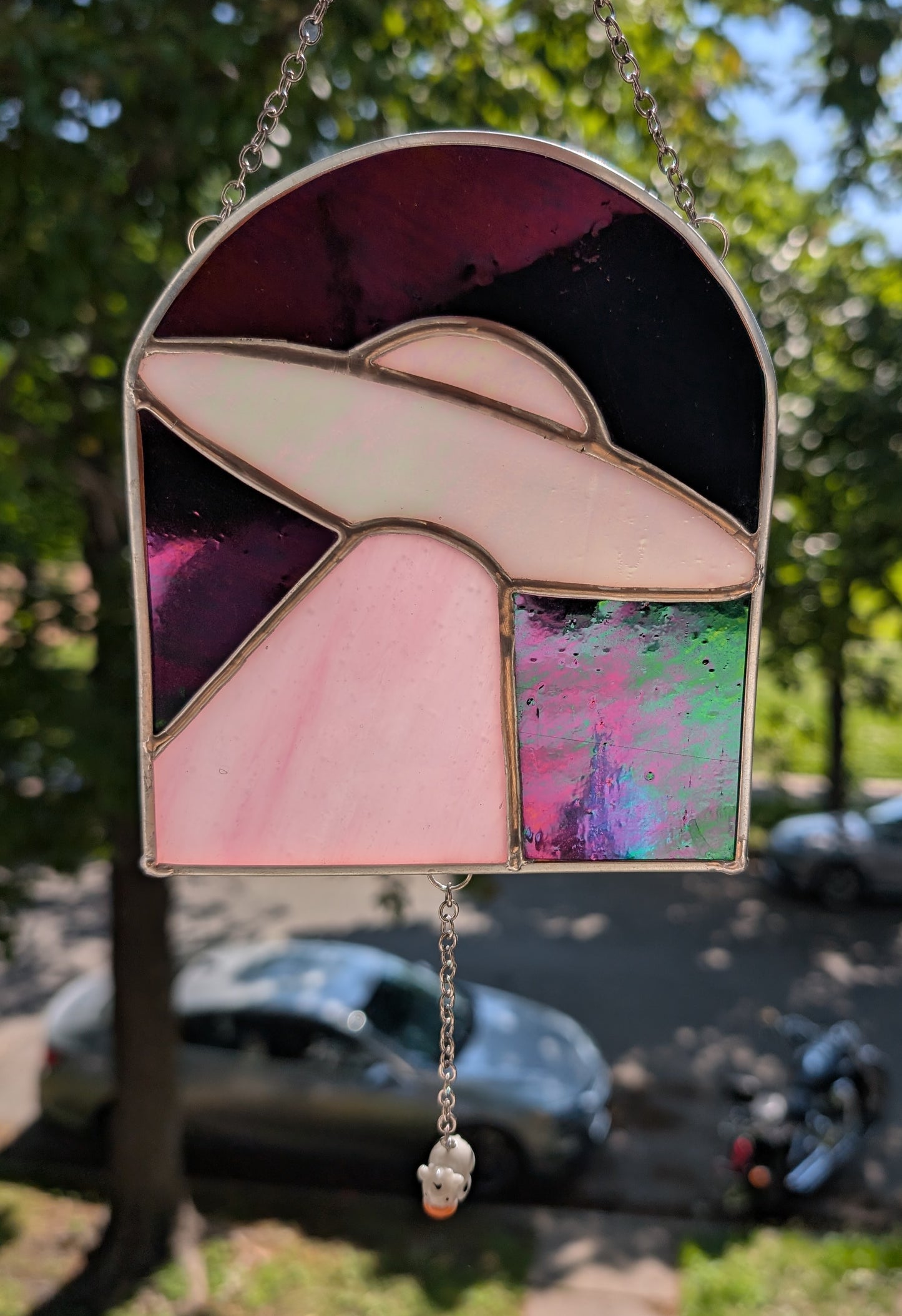 Handcrafted stained glass UFO beaming up a cow pink and black iridescent